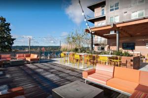 a patio with tables and chairs on a building at Bellevue jr 1br w garden wine lockers nr bars SEA-616 in Redmond