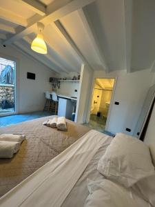 a large bedroom with a bed and a kitchen at CASA MEDUSA in La Spezia