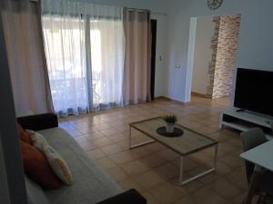 Telewizja i/lub zestaw kina domowego w obiekcie Vivienda Vacacional Orquidea