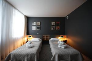 Postel nebo postele na pokoji v ubytování Hotel Navalis, Klaipėda