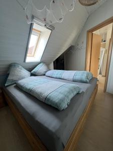 a bedroom with two beds in a attic at Fewo 3 - Seehaus Hoyer in Gunzenhausen