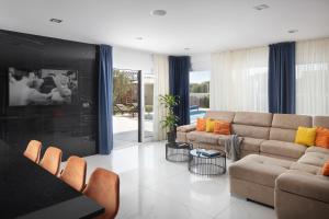 a living room with a couch and a table at Villa Monte Kope in Banjole