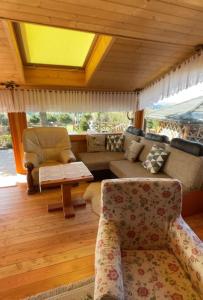 a living room with a couch and a table at Nasza Chata in Jaworzynka