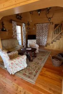 a living room with a couch and a table at Nasza Chata in Jaworzynka