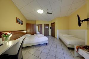 Postel nebo postele na pokoji v ubytování Hotel Residence Zust