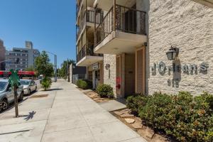 a building with a sign on the side of a street at Long Beach 1br nr aquarium groceries bars LAX-1156 in Long Beach