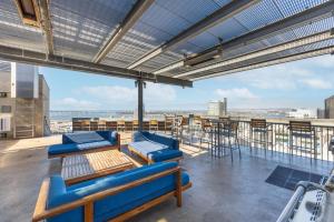 a view from the roof of a building with chairs and tables at East Village 1br w rooftop nr park bars SAN-40 in San Diego