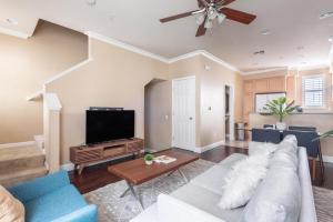 a living room with a couch and a tv at Milpitas 2br w garage nr coffee groceries SFO-1597 in Milpitas