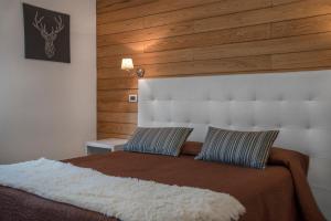 Postel nebo postele na pokoji v ubytování Piccolo Hotel Aurora