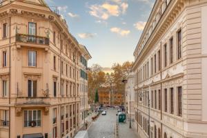 a view of a street between two buildings at Relais del Portico in Rome