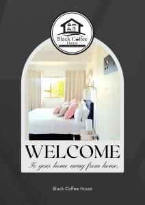 a poster of a bedroom with a bed in a room at Black Coffee House in Auckland