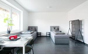 Posezení v ubytování Moderne Wohnung im Zentrum + 25 fotografií