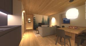 a kitchen and living room with a table and a couch at DALANIA MOUNTAIN APARTMENTS in Ponte di Legno