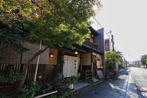 a building on the side of a street at Yadoya Kikokuso in Kyoto