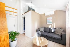 a living room with a couch and a table at Lisbon Oriente Suites by Olala Homes in Lisbon