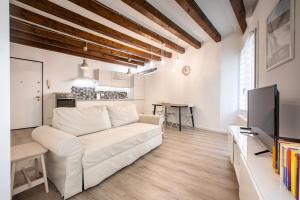 A television and/or entertainment centre at San Faustino Central Apartment