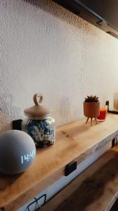 a wooden shelf with a pot on top of it at La Casa di Costanza in Valtournenche