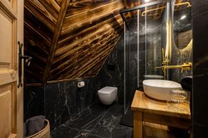 a bathroom with a sink and a toilet at Pokoje Javorina in Zakopane +63 photos