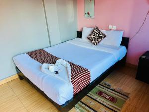 Postel nebo postele na pokoji v ubytování Hotel Donosti Pokhara