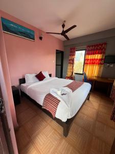 Postel nebo postele na pokoji v ubytování Hotel Donosti Pokhara