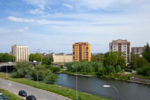 a view of a city with a river and buildings at Elite Apartments Luna Spa&Welness in Gdańsk