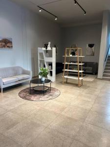 a living room with a couch and a table at Circa Apartment 86 in Pretoria +28 photos