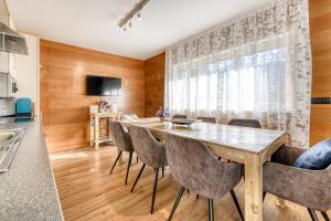 a dining room with a table and chairs at Haus Galgenul by A-Appartments in Galgenul