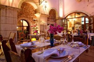 Reštaurácia alebo iné gastronomické zariadenie v ubytovaní Veneto Boutique Hotel