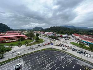 a city with a lot of traffic on a street at ADEEN'S SURIA SUITE, Hotel Mutiara Gua Musang in Gua Musang