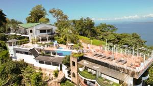 an aerial view of a house with a swimming pool at Blue Mirador Hotel Manuel Antonio in Manuel Antonio
