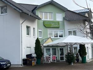 a building with a sign on the front of it at Hotel-Restaurant Denklinger-Hof in Reichshof 