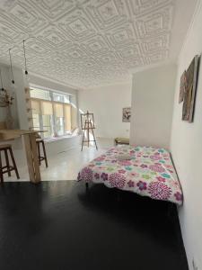 a bedroom with a bed and a coffered ceiling at Andreevskiy mini-hotel in Kyiv