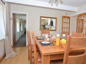 a dining room with a wooden table and chairs at 2 Bed in Nr Gibside CN080 in Whickham