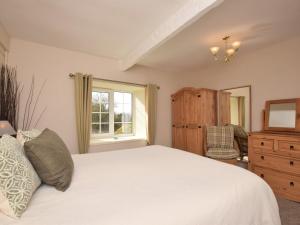 a bedroom with a large white bed and a window at 2 Bed in Nr Gibside CN080 in Whickham