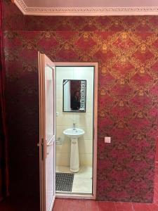 a bathroom with a sink and a mirror at Sabir's Apartment Old Town in Tbilisi City