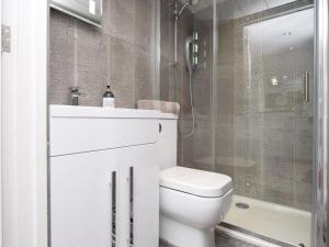 a bathroom with a toilet and a sink and a shower at 1 Bed in Durham 76615 in Lanchester