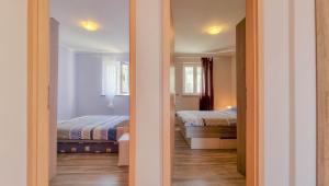 Postel nebo postele na pokoji v ubytování Crveni Vrh 4