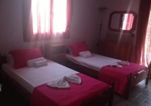 Postel nebo postele na pokoji v ubytování Lygies Apart Hotel