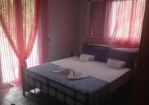 Postel nebo postele na pokoji v ubytování Lygies Apart Hotel