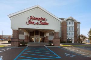 a hampton inn and suites building in a parking lot at Hampton Inn & Suites Scottsburg in Scottsburg
