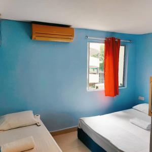 Postel nebo postele na pokoji v ubytování RAS Hotel