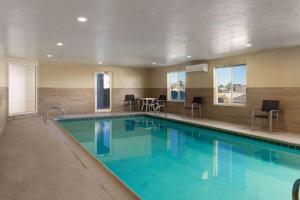 a large swimming pool in a hotel room at Wingate by Wyndham Cedar City in Cedar City +56 photos
