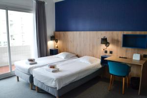 Ένα ή περισσότερα κρεβάτια σε δωμάτιο στο Villages Clubs du Soleil - LA BAULE
