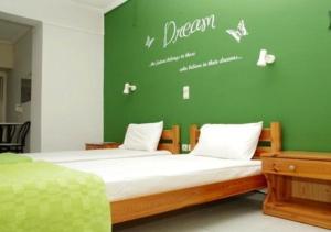 Postel nebo postele na pokoji v ubytování Lygies Apart Hotel