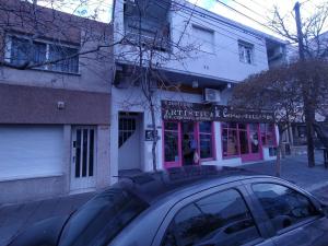 a car parked in front of a building at Center Studio pax 3 apartamento in Trelew