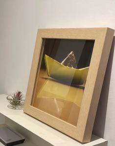 a wooden box sitting on top of a shelf at La Calita del Versalles in Cullera