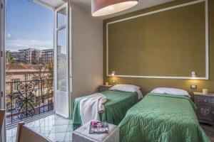 A bed or beds in a room at Amore Rentals - Appartamento Caruso