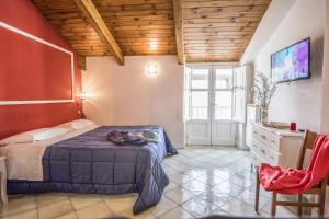 A bed or beds in a room at Amore Rentals - Appartamento Caruso