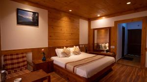 A bed or beds in a room at THE CONIFER