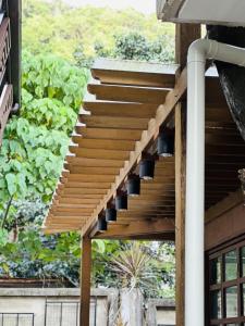 a wooden staircase on the side of a house at The Continental Hostel El Nido in El Nido